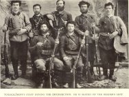 Tchakalaroff's staff during the insurrection. He is seated on the reader's left